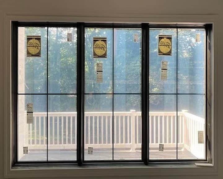 Interior view of black casement replacement windows in new construction home