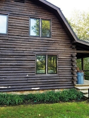 side view of greenville cabin with new wood casement windows