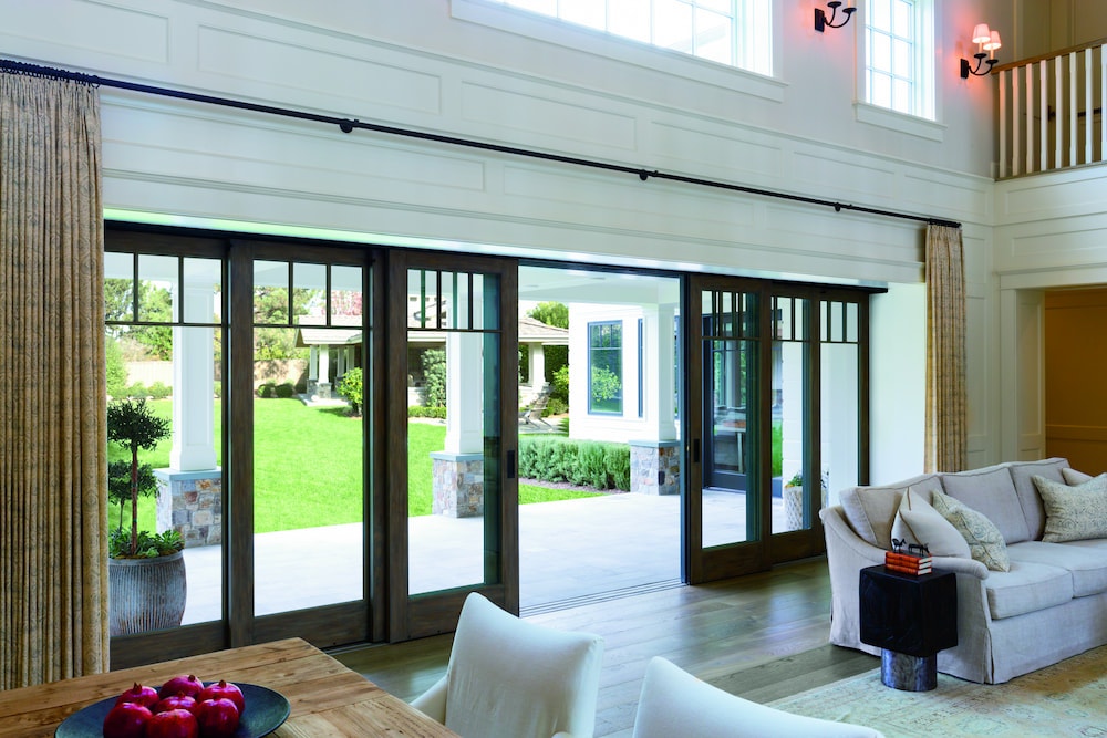 Multi-slide patio doors offer easy access to outdoor patio area from living room
