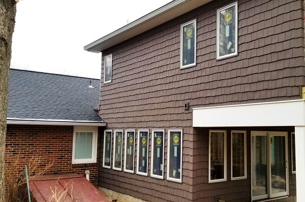 outside of newark home with new wood casement windows