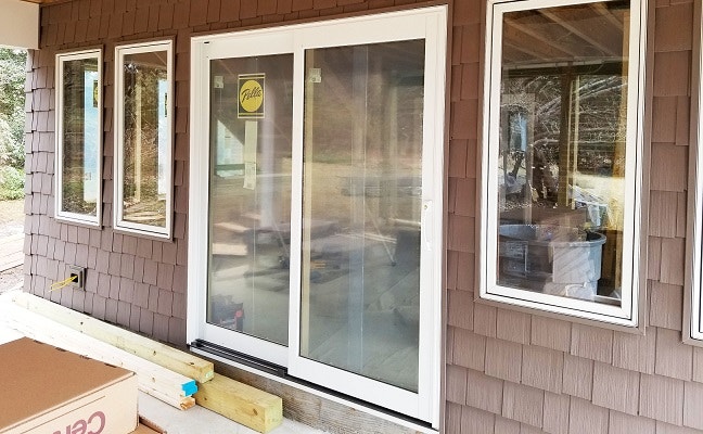 sliding patio door on newark home with new wood casement windows