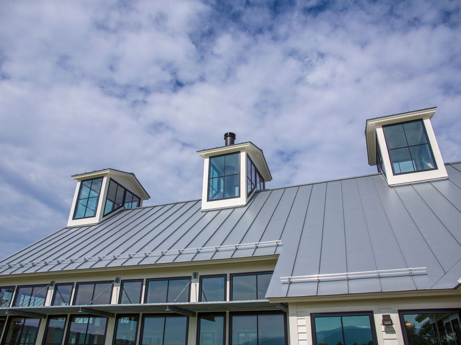 Exterior of large black wood windows on roof of Williamstown, MA, home
