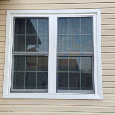 Close up of new vinyl double-hung windows on Mount Juliet, TN, home