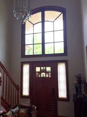 interior view of new wood windows above entry door