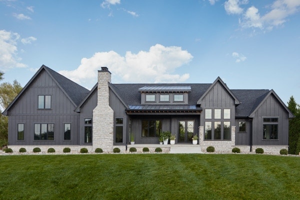 Dark home exterior with light stone accents