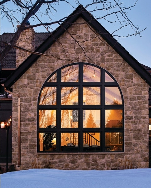 Custom arched window with black grille