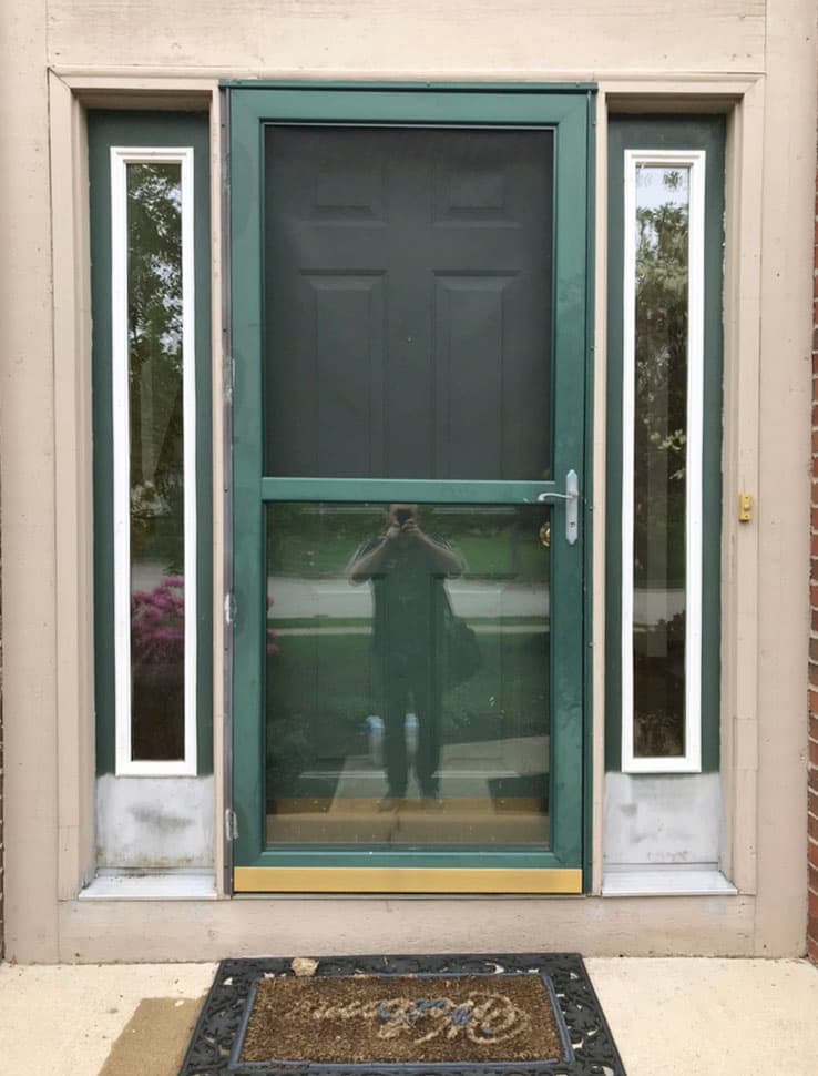 Green entry and storm doors with full-length sidelights