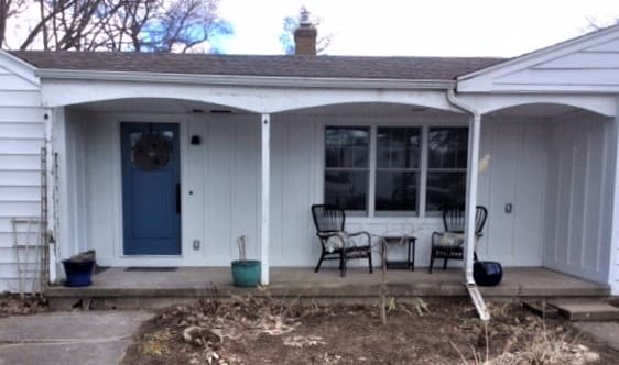 Updated front entry with new wood double-hung windows and new entry door