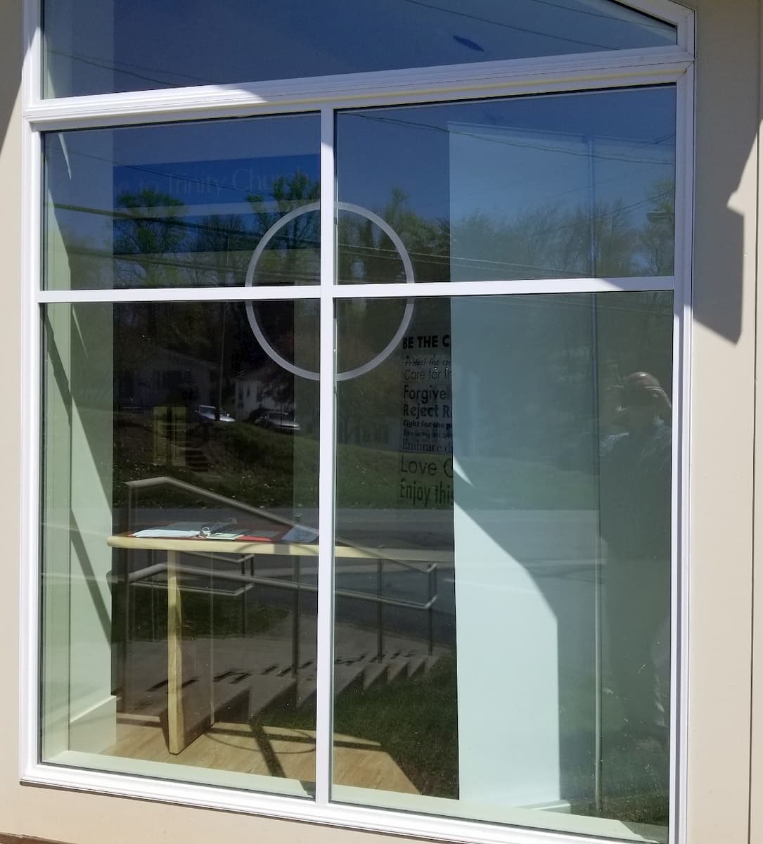 Exterior view of custom wood window with cross grille pattern