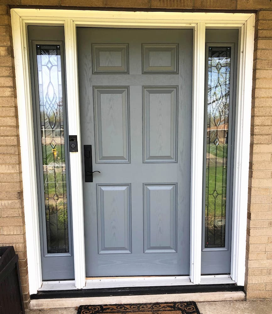 New six-panel fiberglass door with wood grain finish from Pella