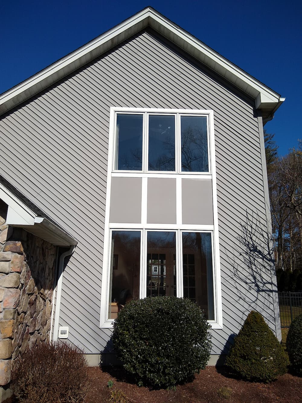 Before exterior view of Ludlow home's existing windows