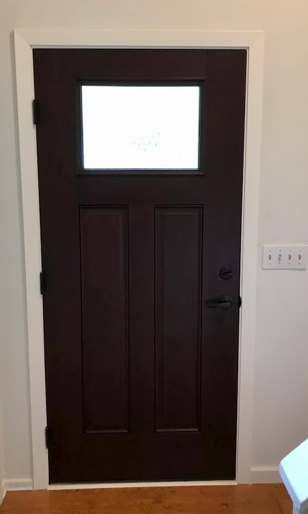 Interior view of new wood Craftsman-style entry door