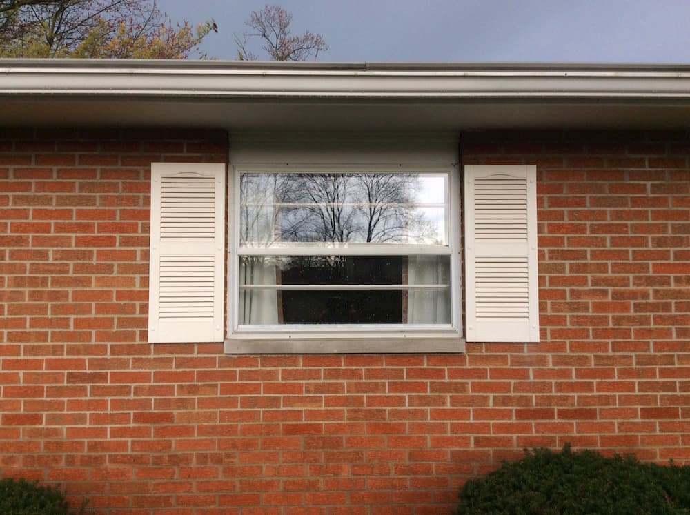 Old double-hung window on a brick home