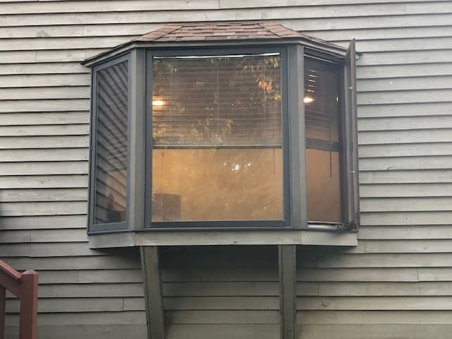 Exterior view of old wood bay window