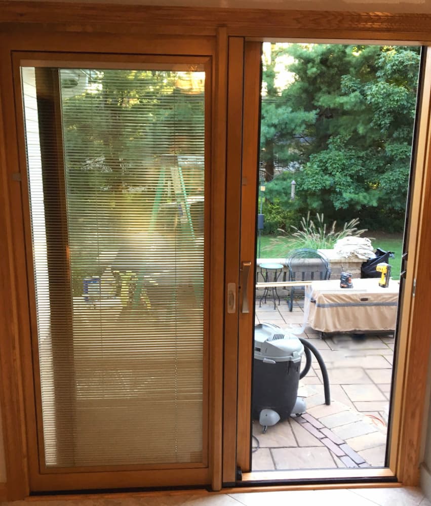 Interior view of new wood sliding patio door with between-the-glass blinds