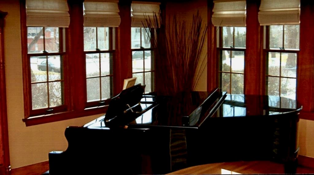 New wood double-hung windows inside a piano room