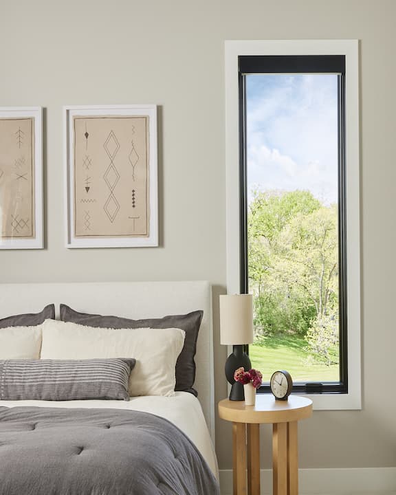 Large black casement window in bedroom
