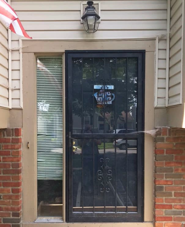 Old entry door on beige home
