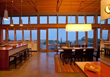 Glass walls in Outermost House at dusk