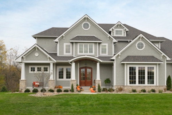 Gray home facade with special shape windows