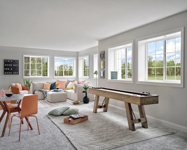 Vinyl sliding windows in living and game rooms