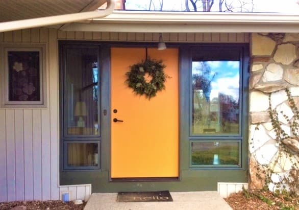 Entryway with new contemporary entry door and wood fixed and awning windows