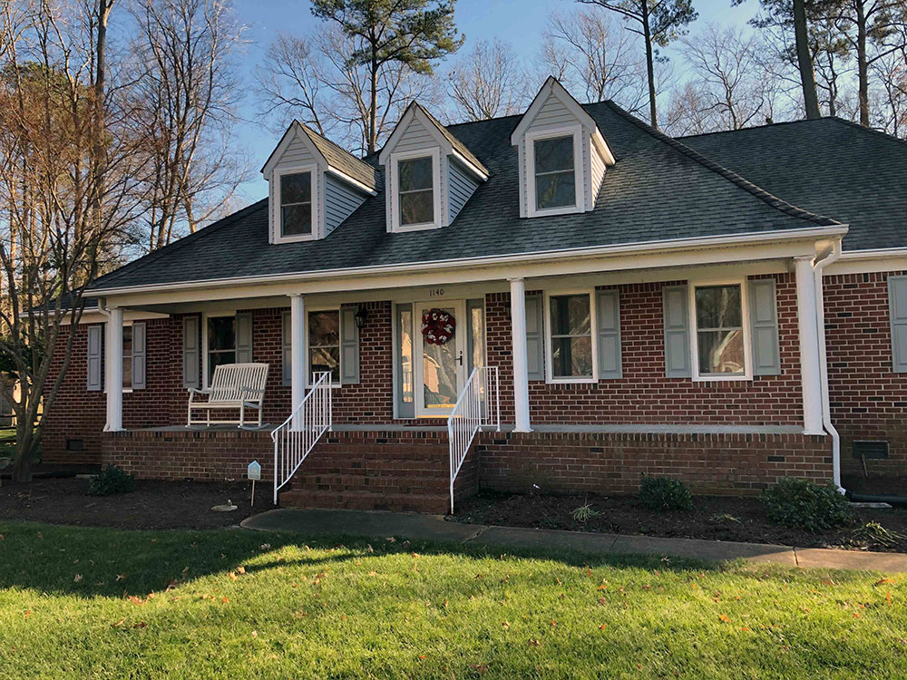 Exterior view of Chesapeake City, Virginia, home with new Pella 350 Series vinyl double-hung windows