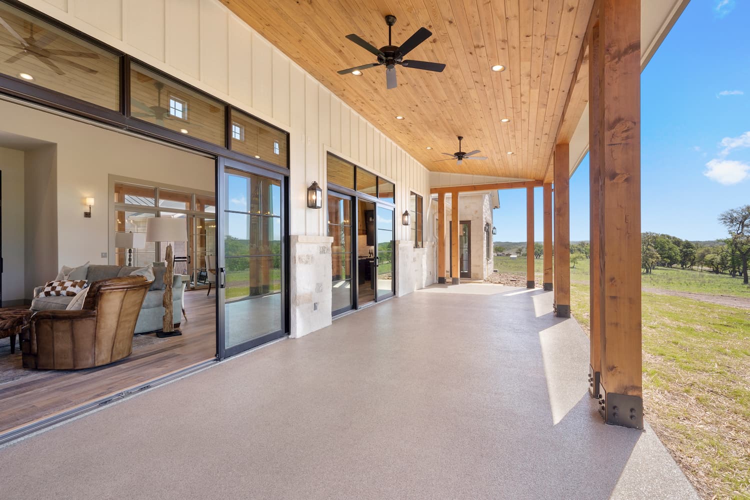 Rear view of Texas farmhouse style home with sliding glass doors