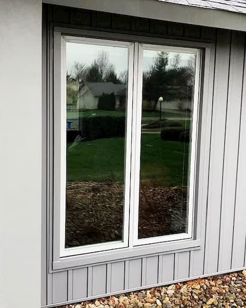 White fiberglass windows on gray home