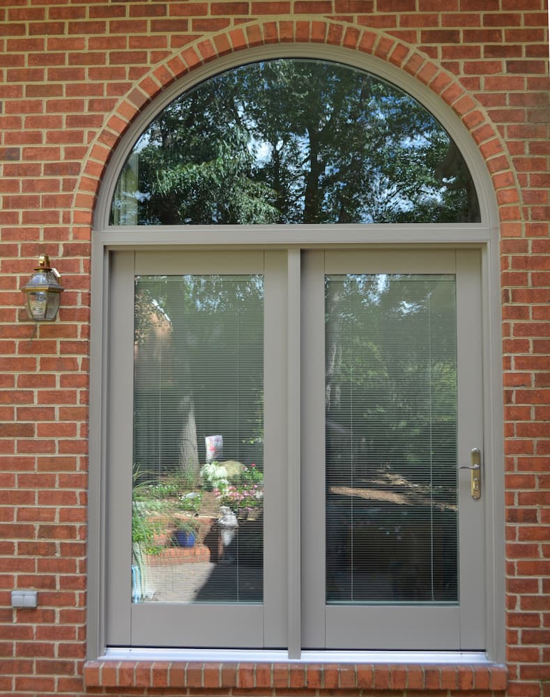New lifestyle series French patio doors on red brick home