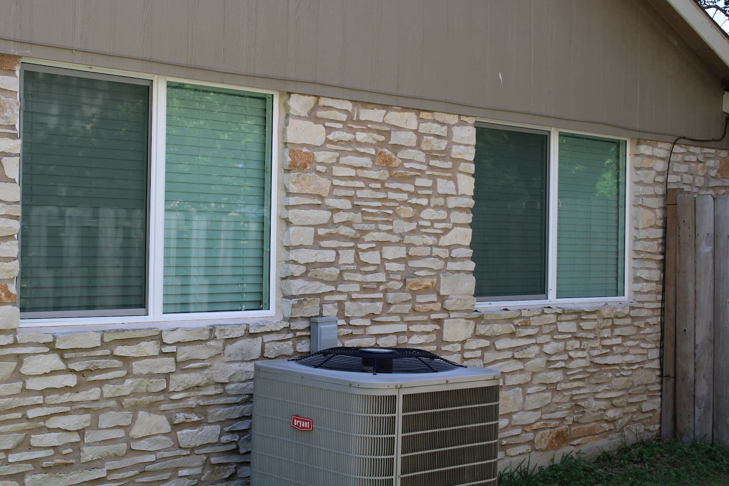 round rock home with a pair of replacement encompass series windows