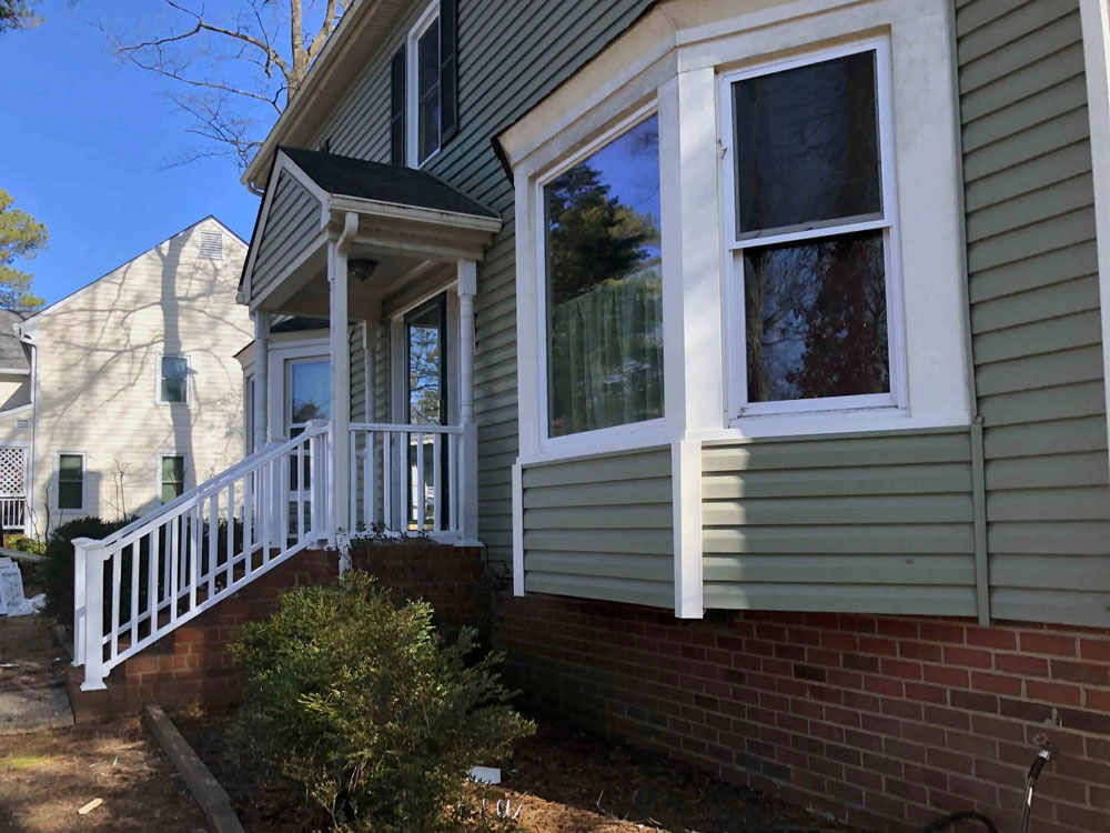Side view of vinyl double-hung windows in Henrico, VA, whole-home window replacement project