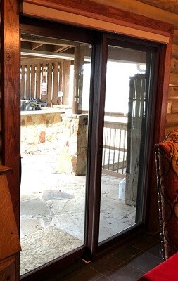 inside of wimberley home with new wood sliding patio door