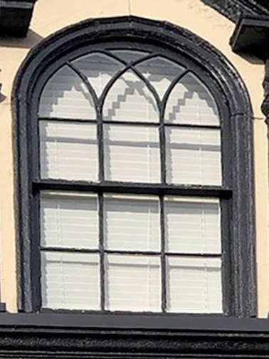 Custom arched window in historic property