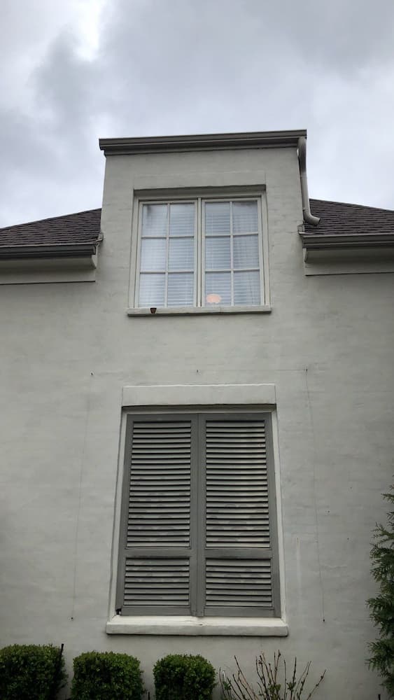 Condo featuring old windows with grilles