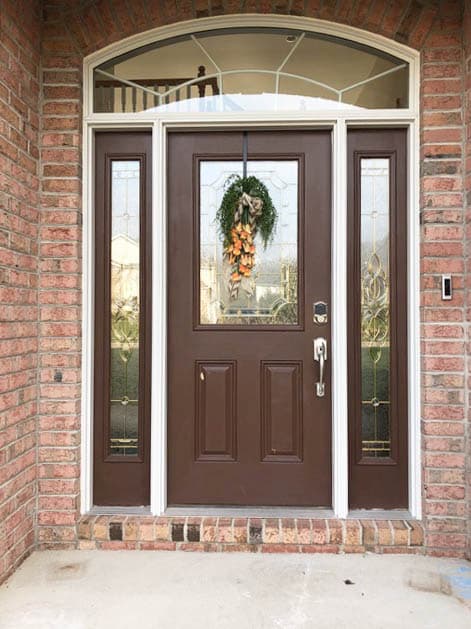 Old single entry door with sidelights