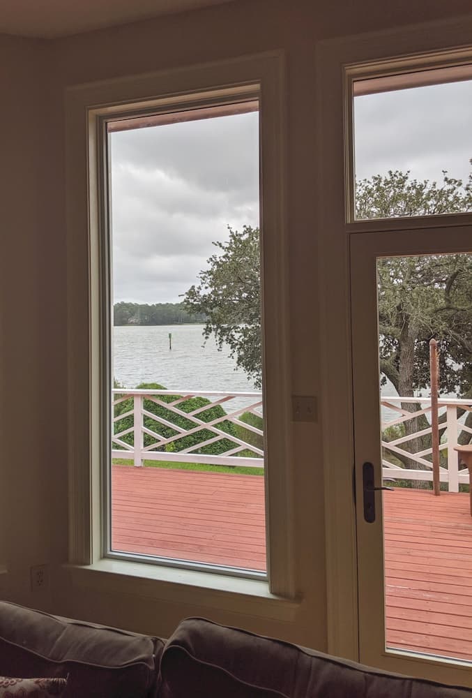 Interior view over deck to water from new fiberglass casement windows