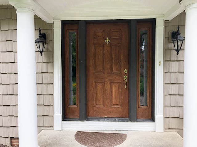 Old wood six-panel entry door with sidelights