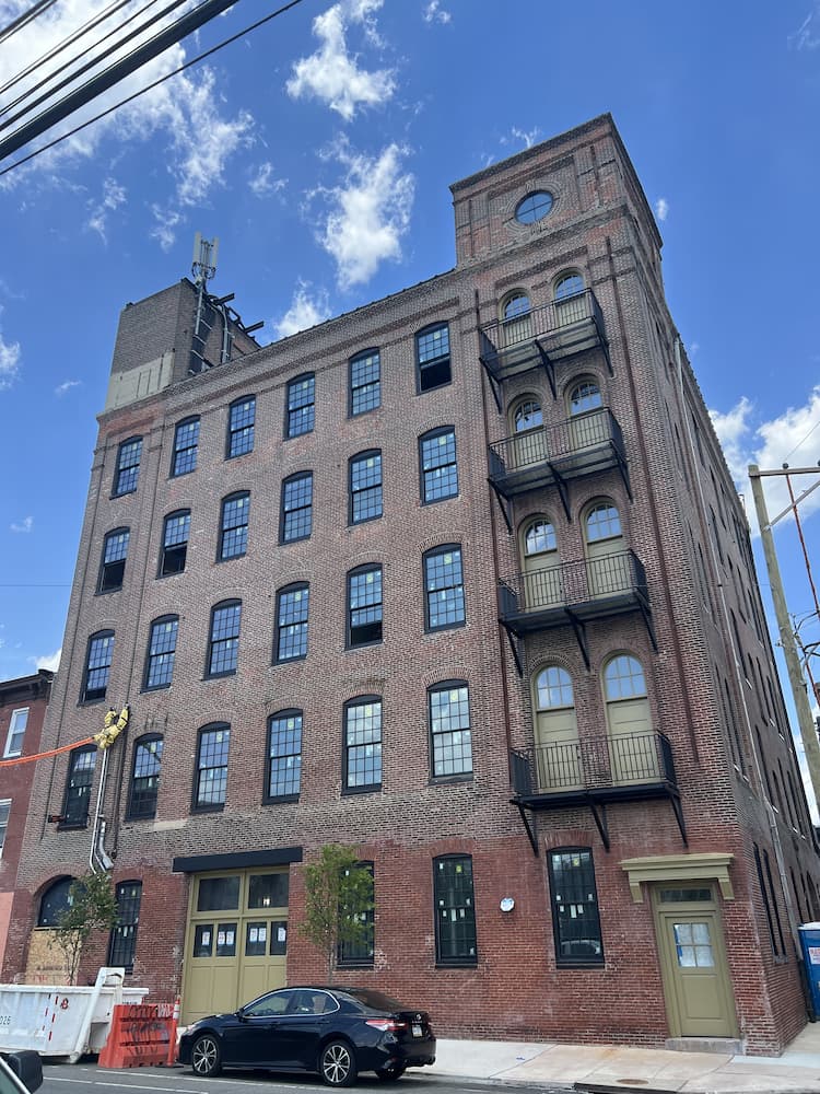 Historic Philadelphia building featuring a wide range of new black window styles