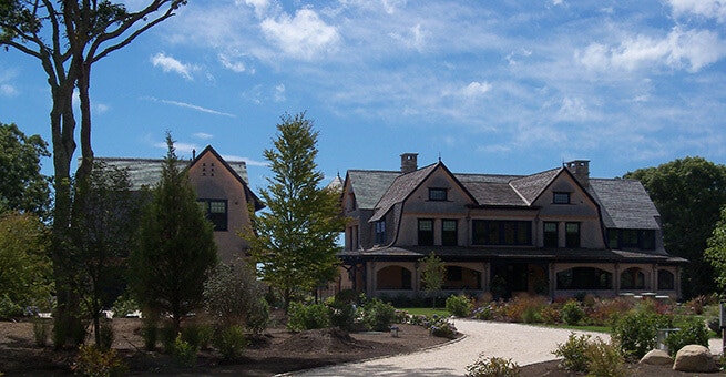 Full view of shingle-style home in South County, RI, with new blue wood windows