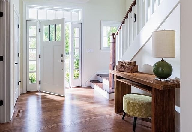 Interior entry of home with front door open