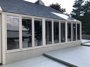 Aluminum-clad wood casement windows overlooking a wooden deck