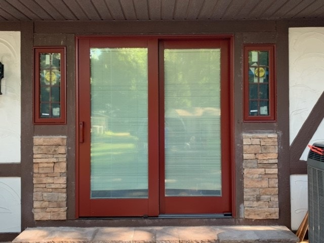 new red sliding glass door with red picture windows on either side