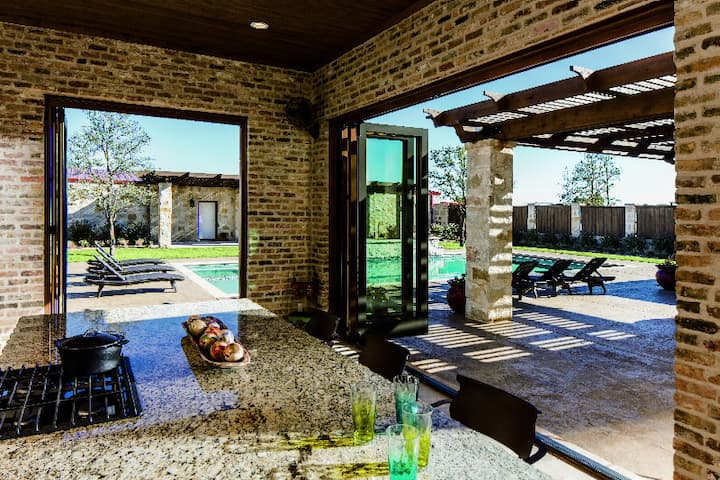 indoor outdoor living scape multi-slide patio doors kitchen pool