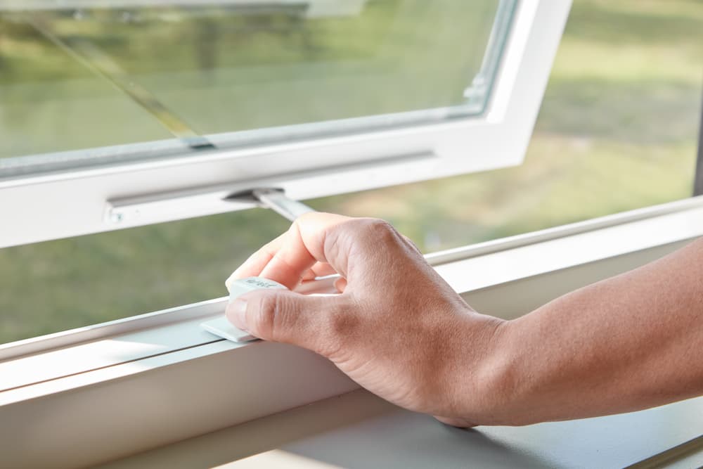 Pella Impervia fiberglass awning window with easy-slide operator