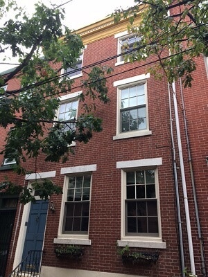 after image of philadelphia home with new wood double hung windows