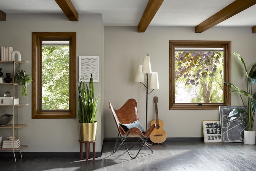 Living room with wood windows with shades halfway down