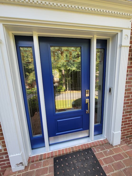 Blue entry door of Charlottesville home