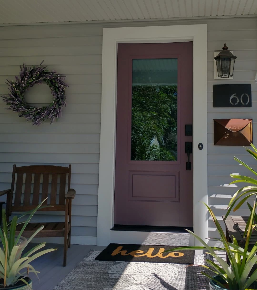 New purple firberglass entry door with 3/4 glass panel and black hardware