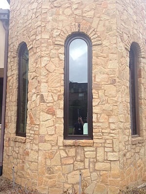 Stone walls with windows curved at top